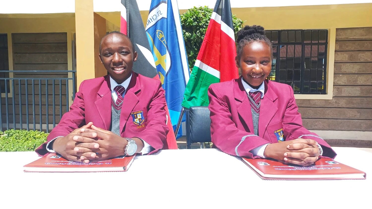 Two St. Christopher's students fielding questions at a school press conference